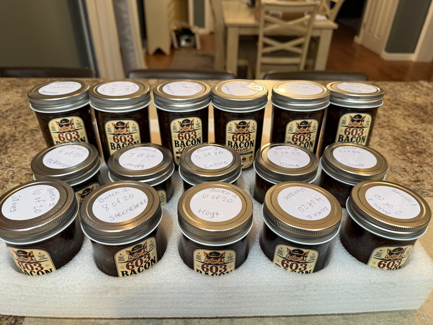 A jar of 603 Bacon Jam held in hand